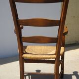 solid wood armchair, straw-covered seat