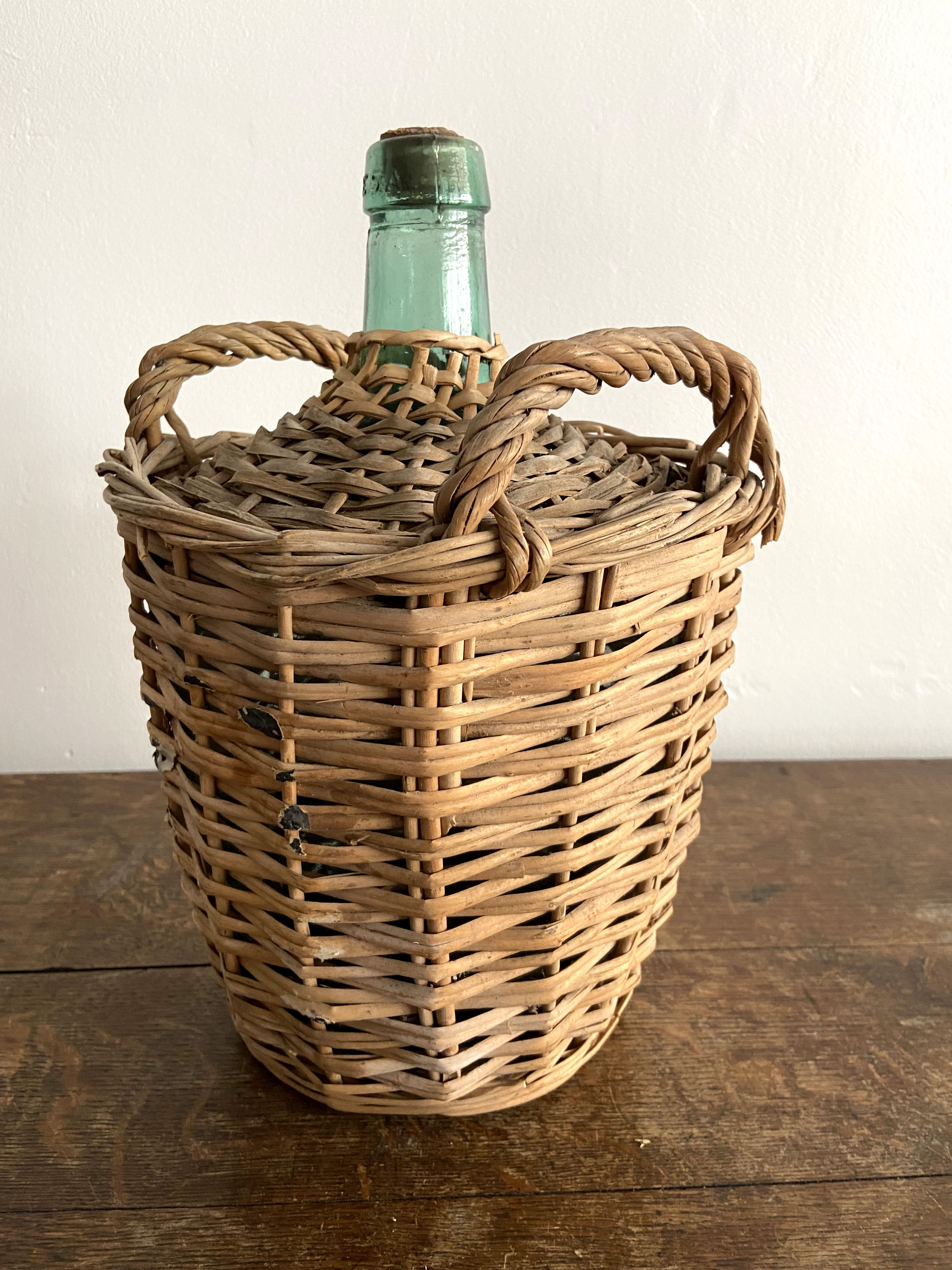 Demijohn surrounded by wicker