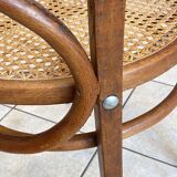 Bistro chair with a curved wooden frame and caned seat from the 1930s.