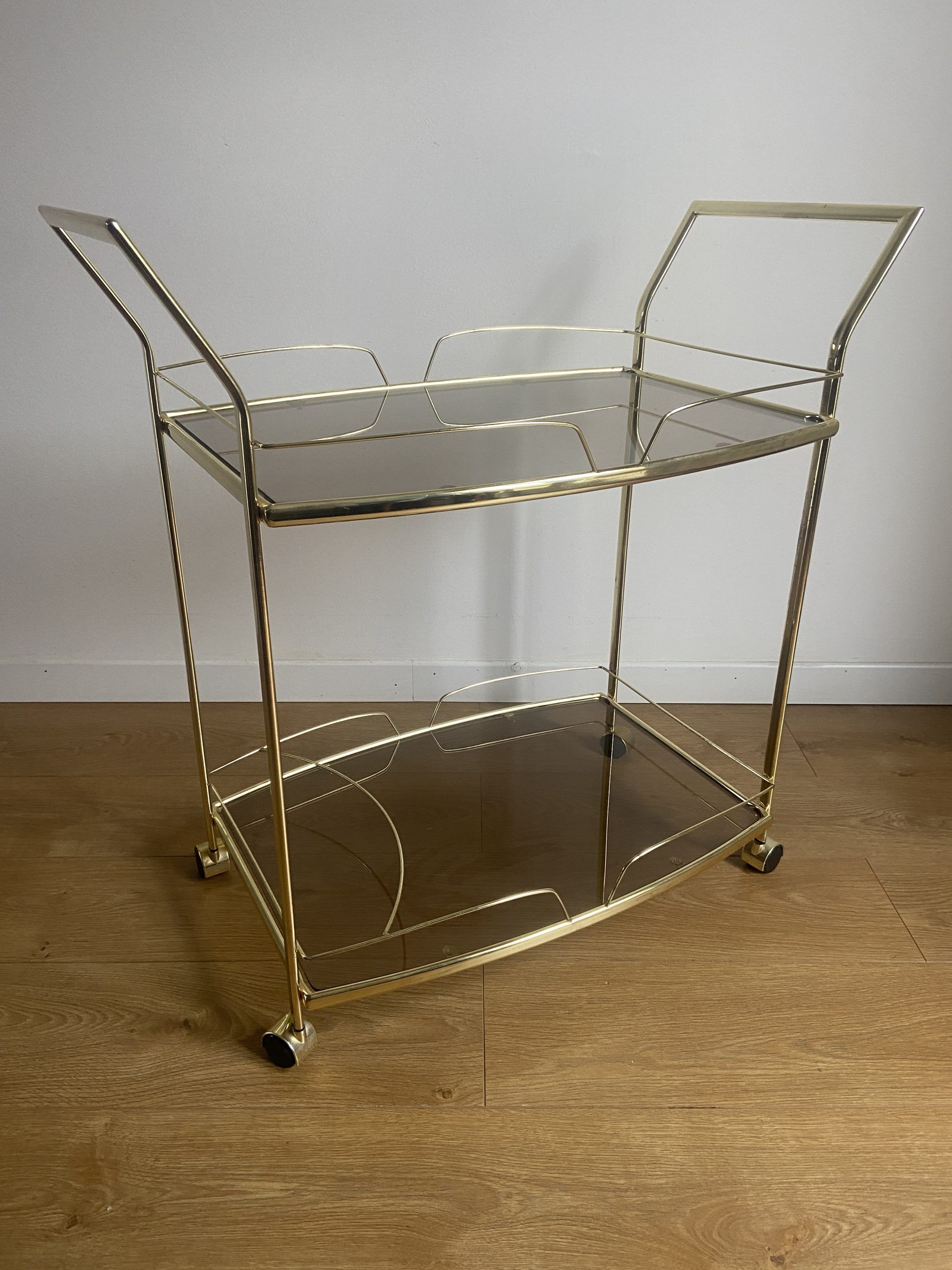 Vintage rolling service in gilded metal and smoked glass