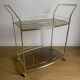 Vintage rolling service in gilded metal and smoked glass