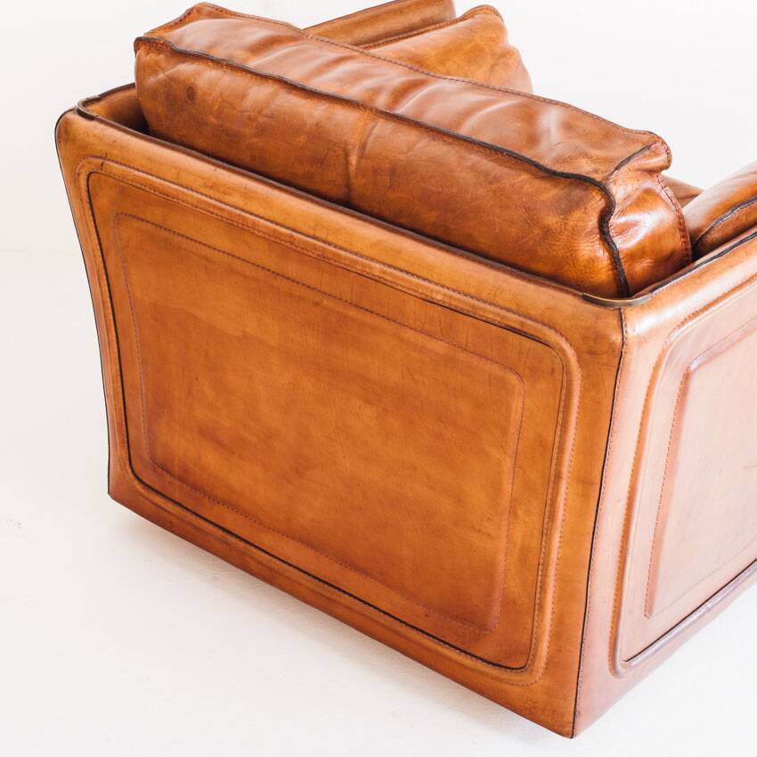 Vintage club armchair by Roche Bobois. Camel buffalo leather. France, 1980s.