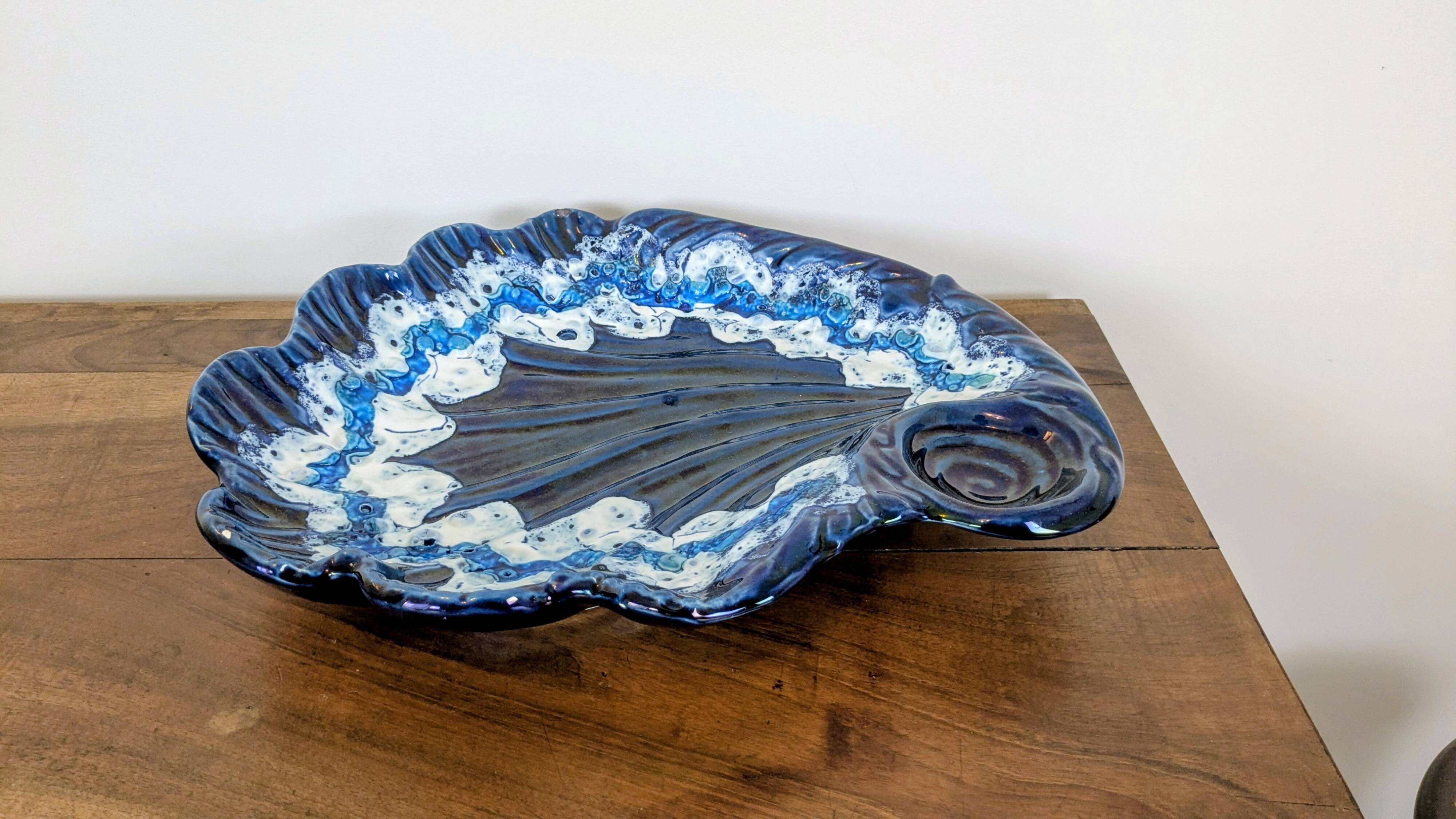 Large vintage shell-shaped blue glazed ceramic bowl