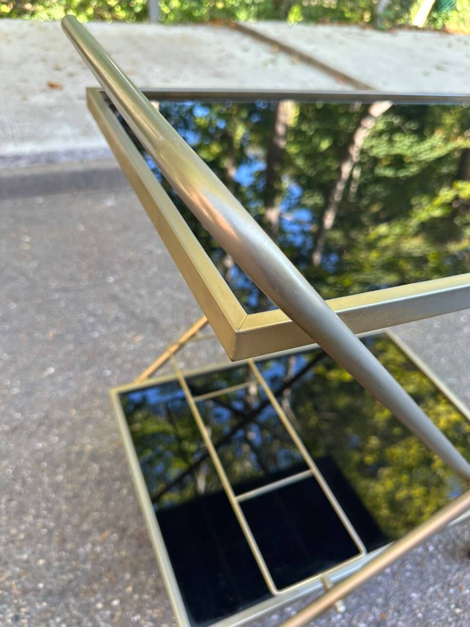 Mid-Century 1978 brass and black smoked glass wheeled dessert trolley.