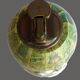Vintage antique lighter with a globe and silver-plated stand.