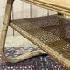 Rattan coffee table and caned shelf from the 1970s.