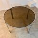 Table ronde vintage tubulaire en métal et verre fumé design année 70