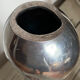 Large organic vase in polished aluminium cast.