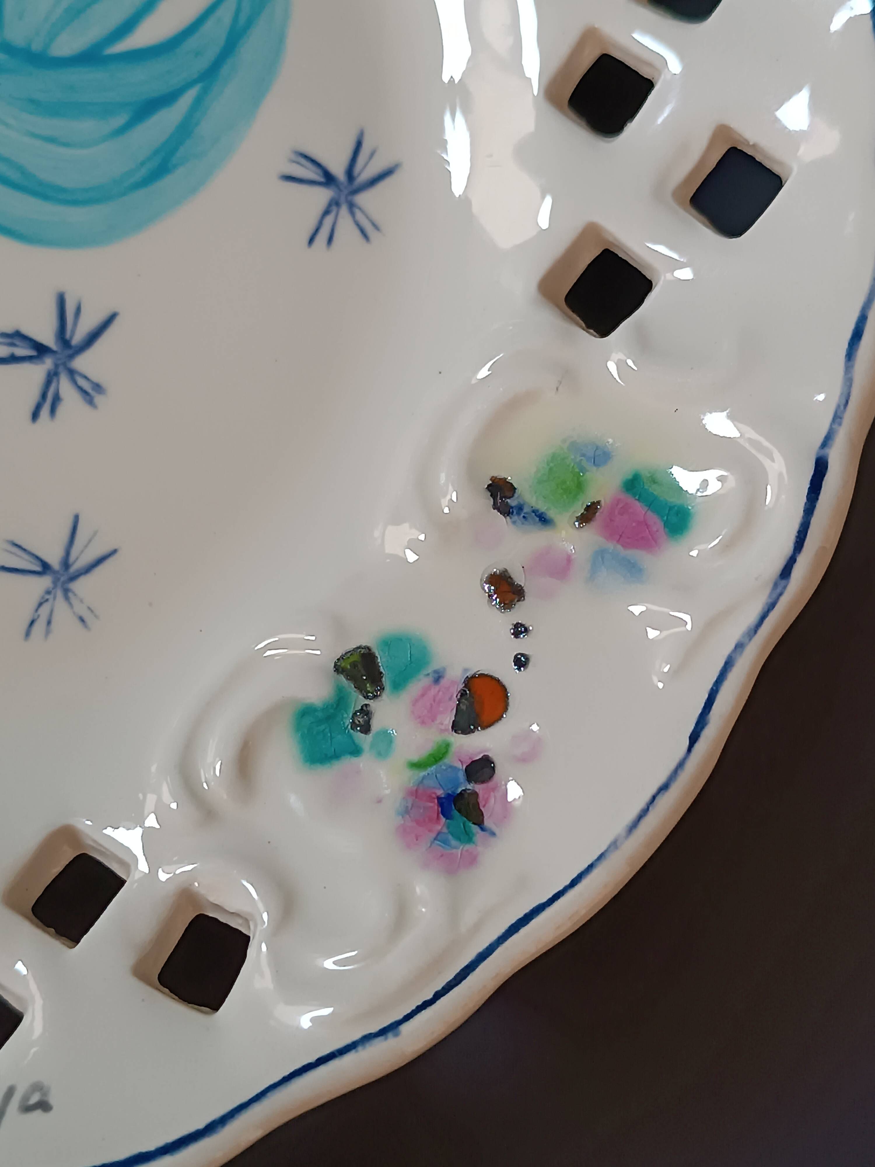 Vintage painted ceramic wall plate with cut-out design by Claude Smadja.