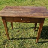 Wooden table with a drawer