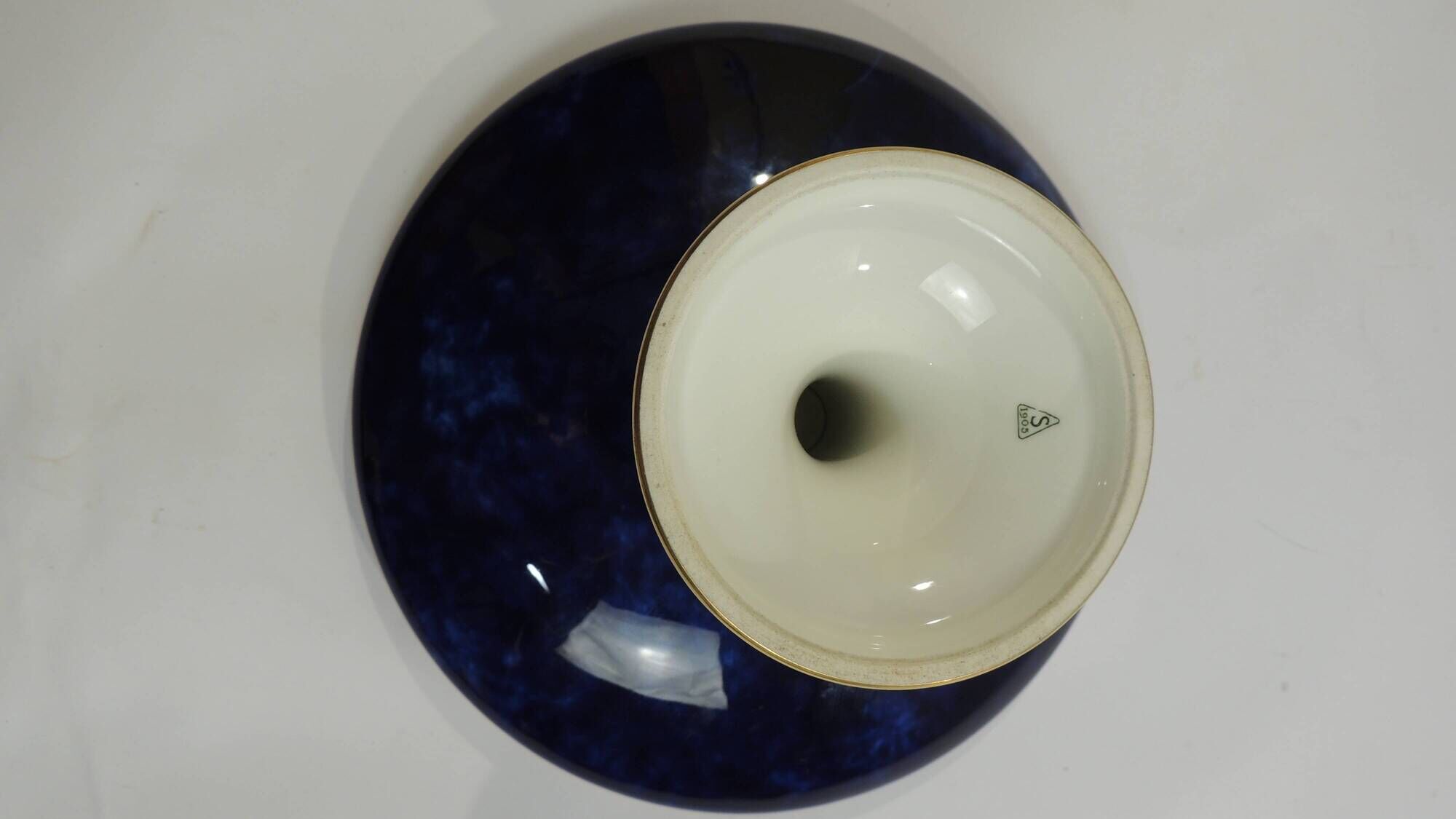 Sèvres porcelain cobalt blue footed bowl with gold rim – center