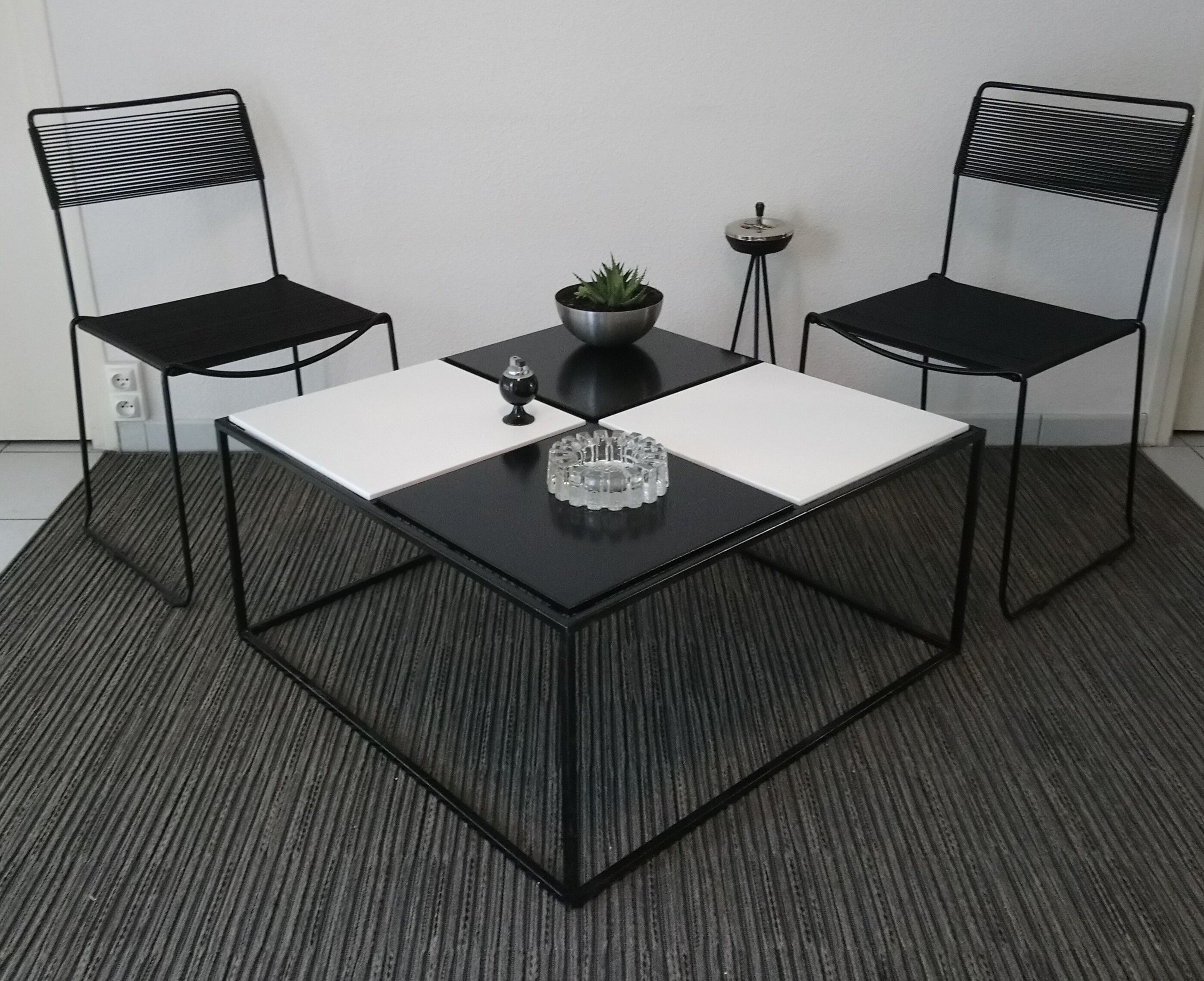 Square coffee table has checkered 80s