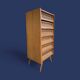 Vintage rattan chest of drawers with splayed legs from the 1950s.