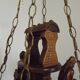 French vintage Breton chandelier with hand-carved figures, well, and lantern lights.