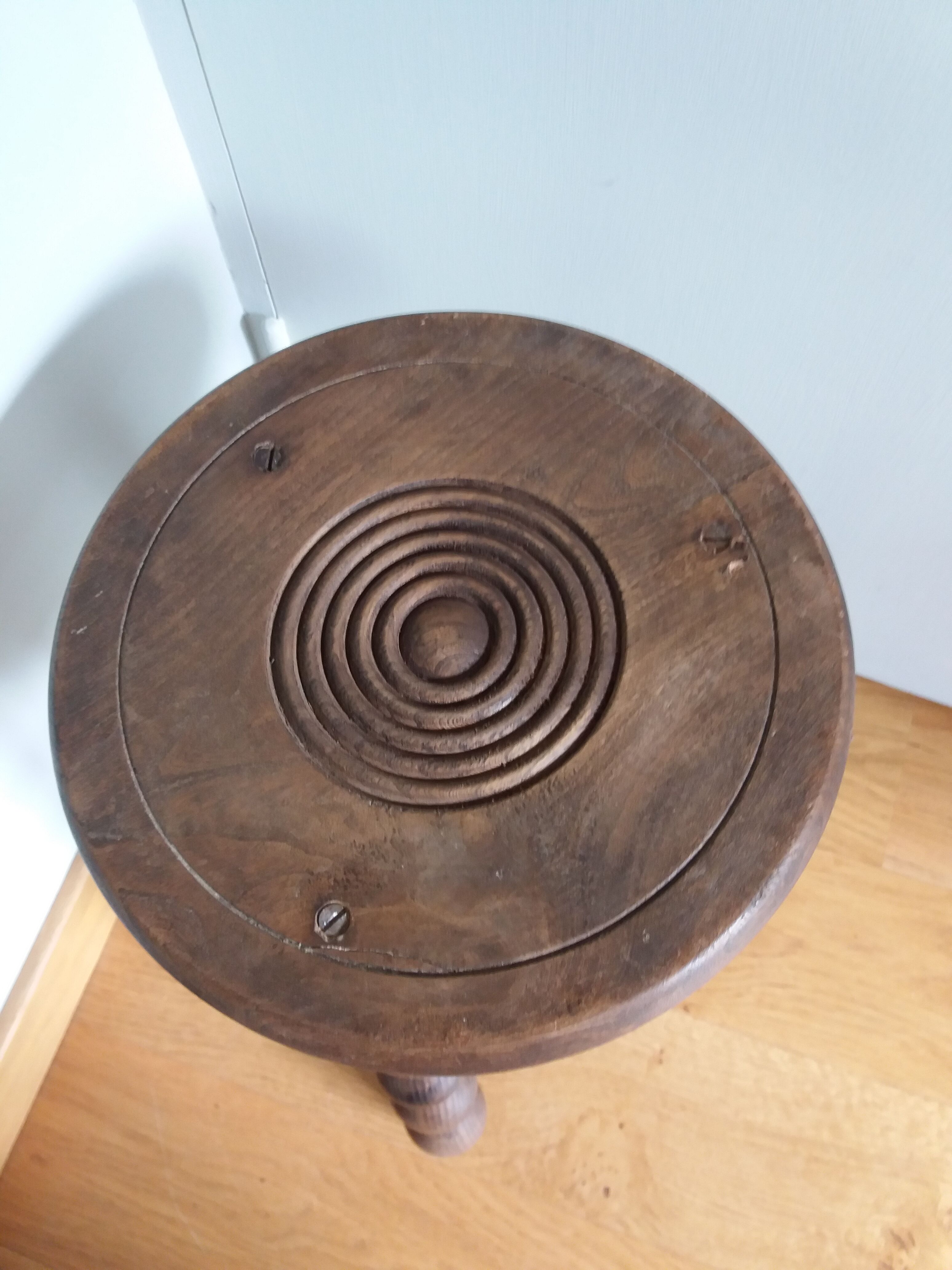 Tripod stool in wood turned coil way