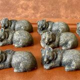 12 elongated brown bear-shaped knife rests