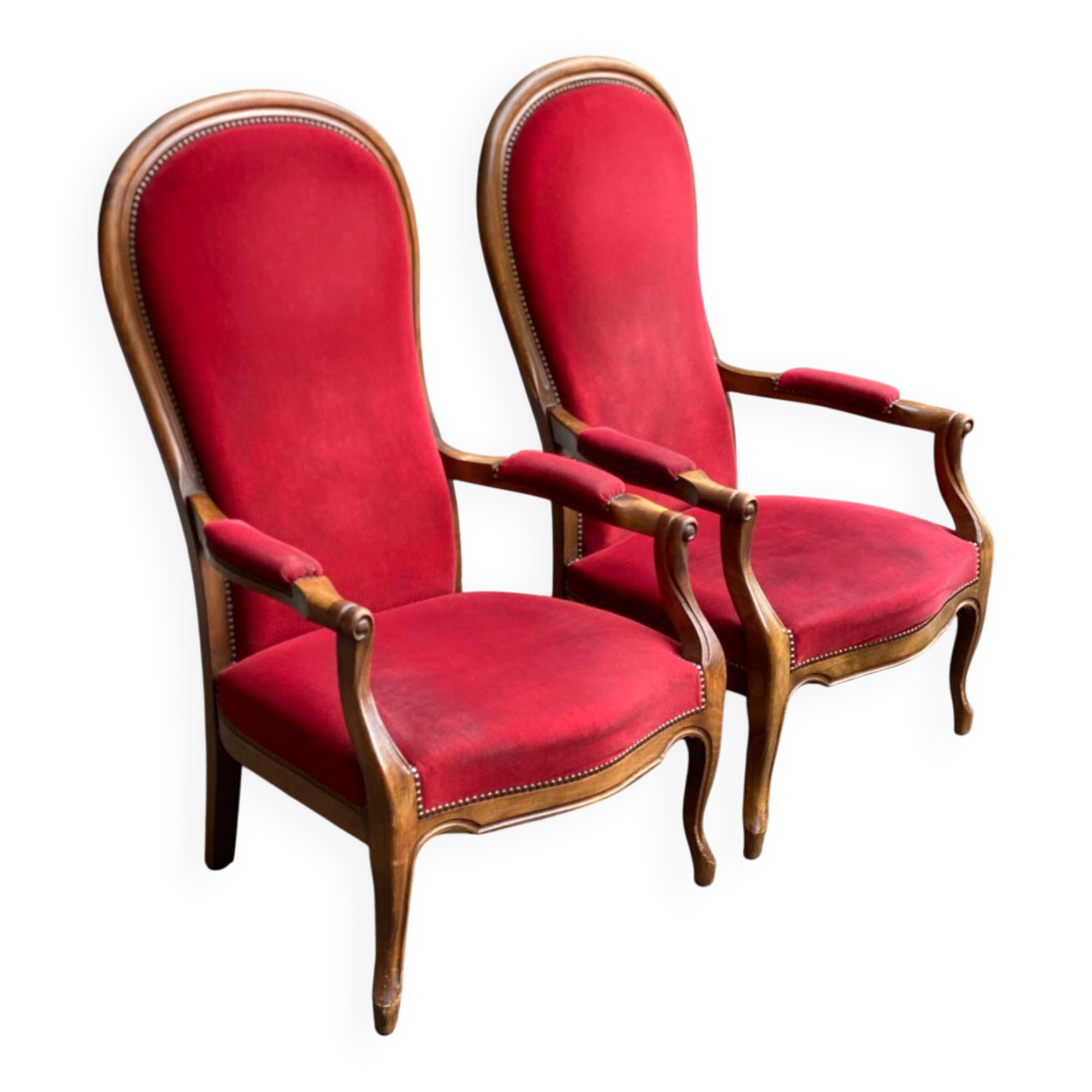 2 Louis Philippe cabriolet armchairs in burgundy velvet wood from the 19th century.