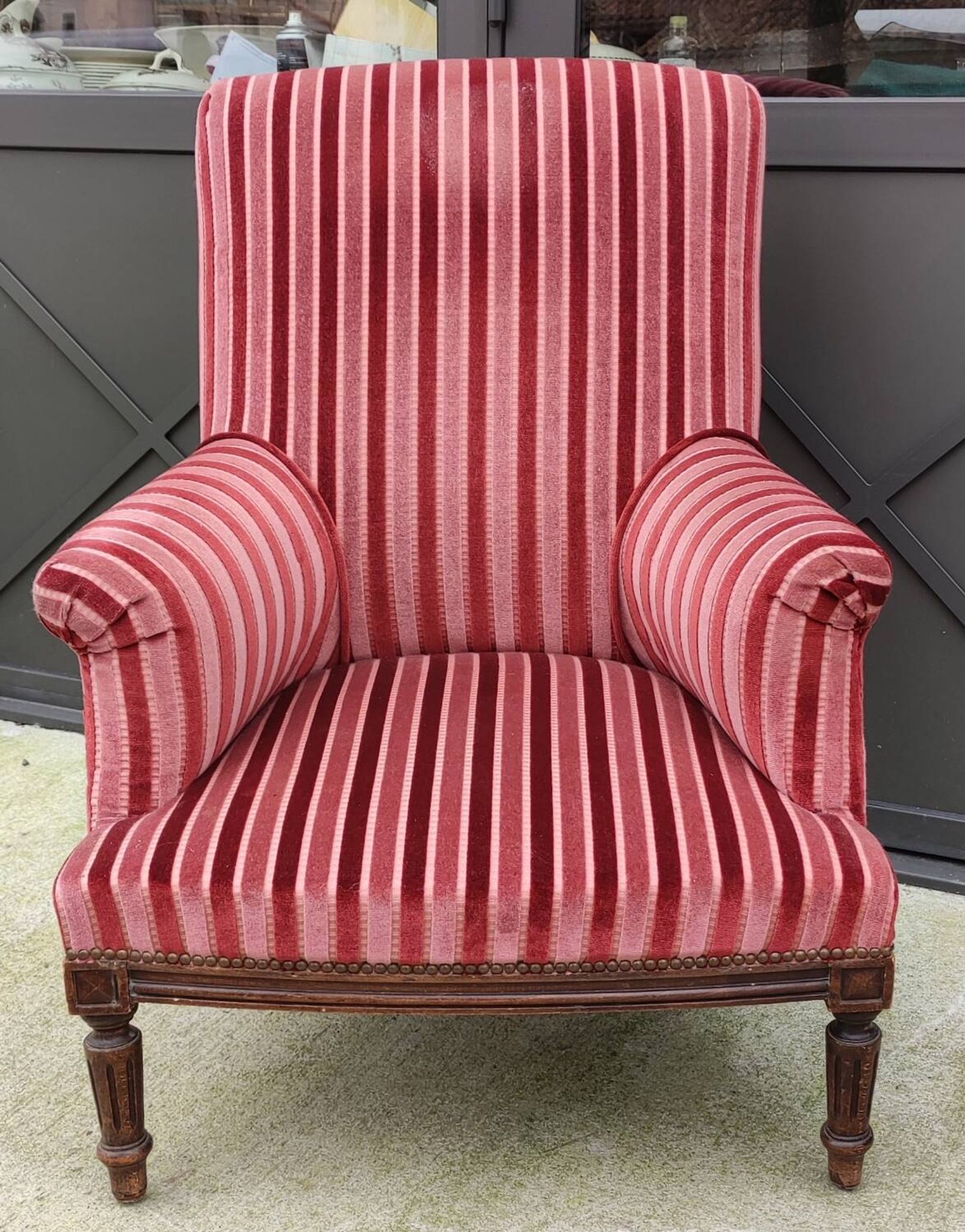 Old armchair and its Louis XVI style footrest/velvet covering