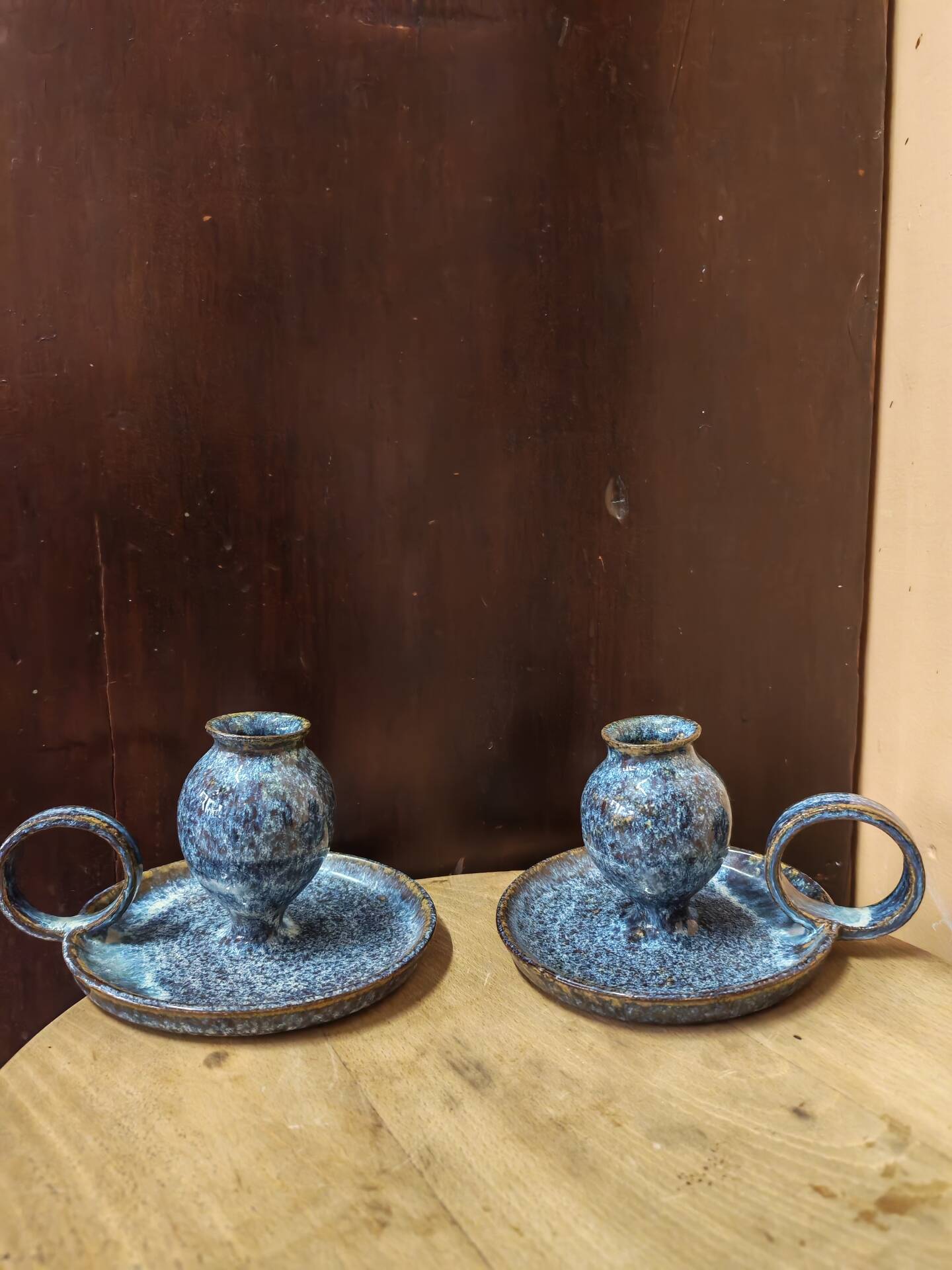 Pair of speckled glazed ceramic candle holders rat of the cellar