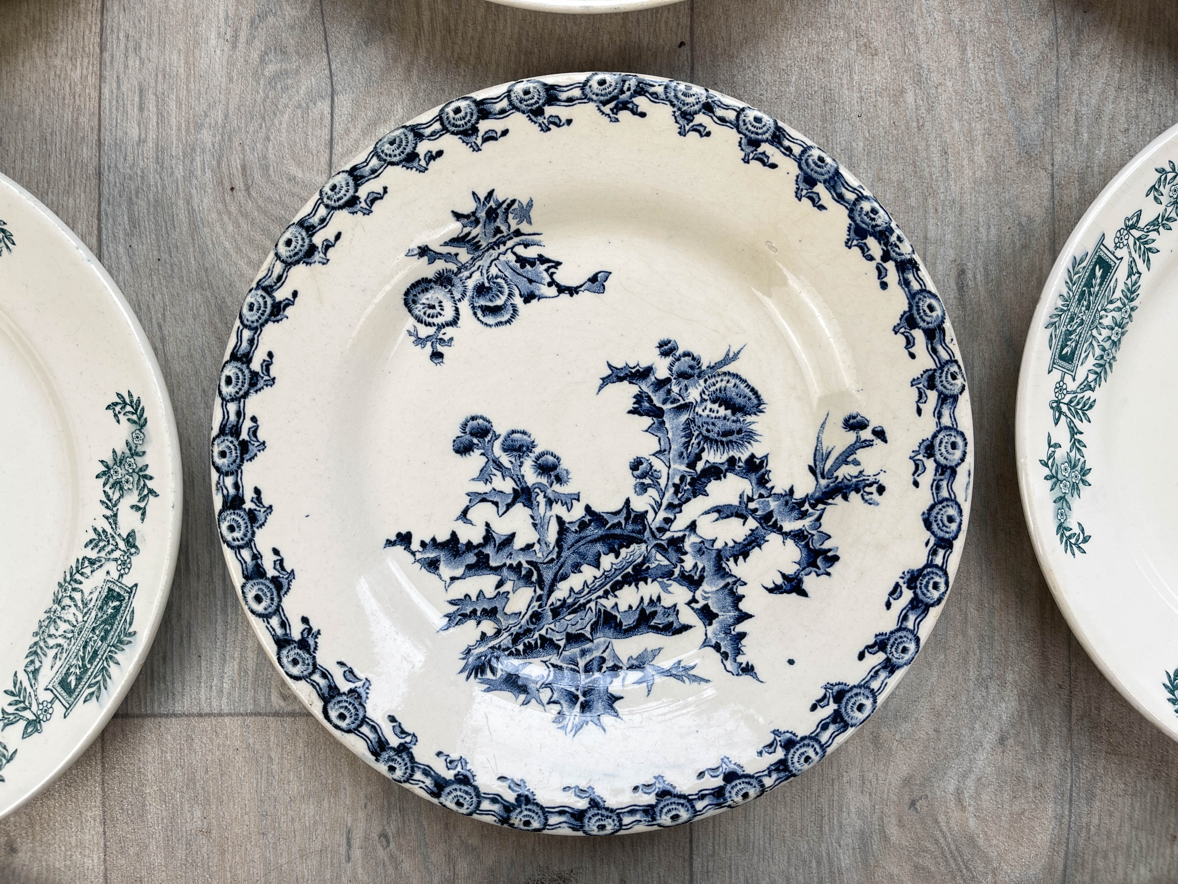 6 green and blue mismatched iron earth plates