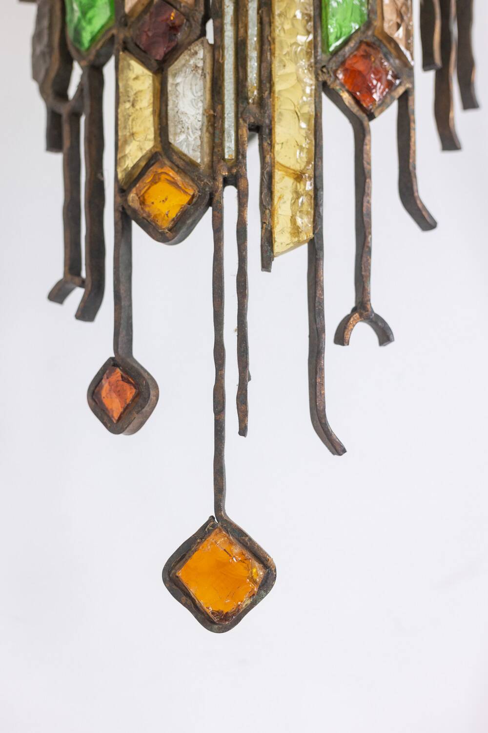 Wrought iron and colored glass wall light. 1960s.