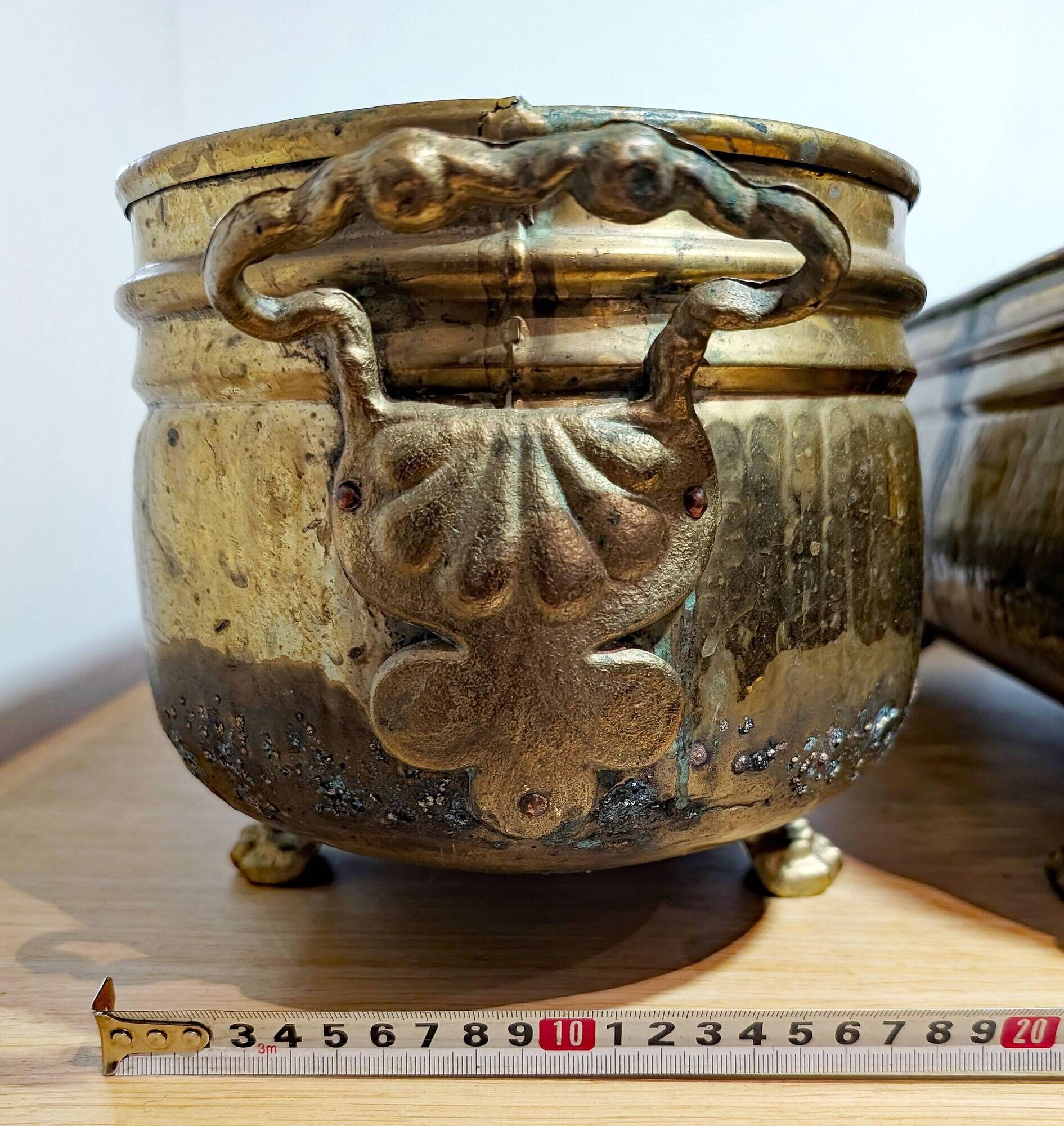 Pair of large antique planters with lion's paw feet.