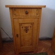 Vintage wooden bedside table painted brown, with a drawer and door, painted decoration from the 1890s.