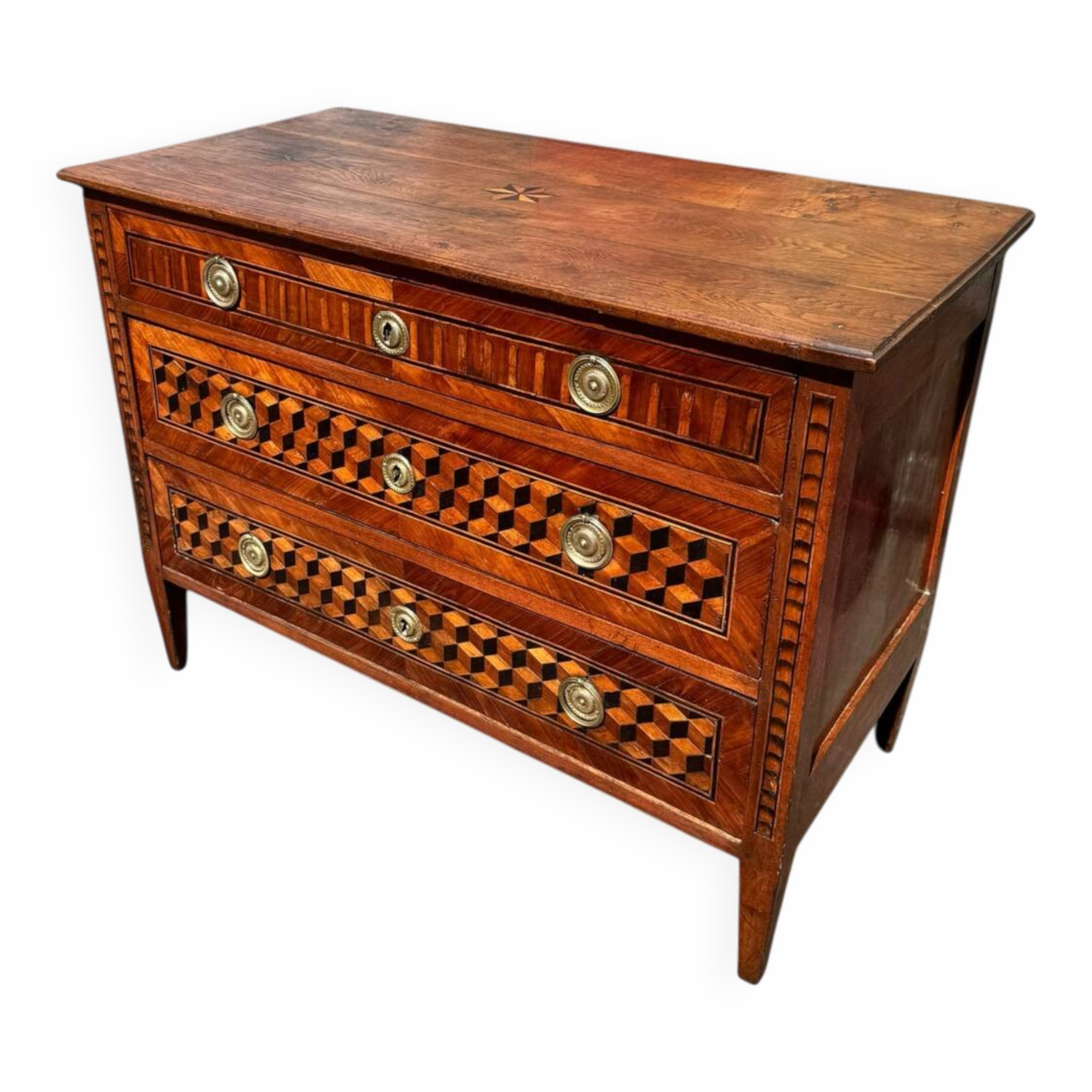 Louis XVI commode with marquetry featuring a design of precious wood cubes, 18th century.
