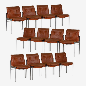 Series of twelve chairs in leather and chromed metal, 1970s
