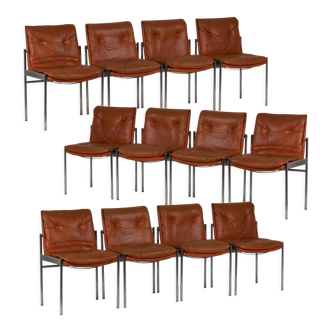 Series of twelve chairs in leather and chromed metal, 1970s