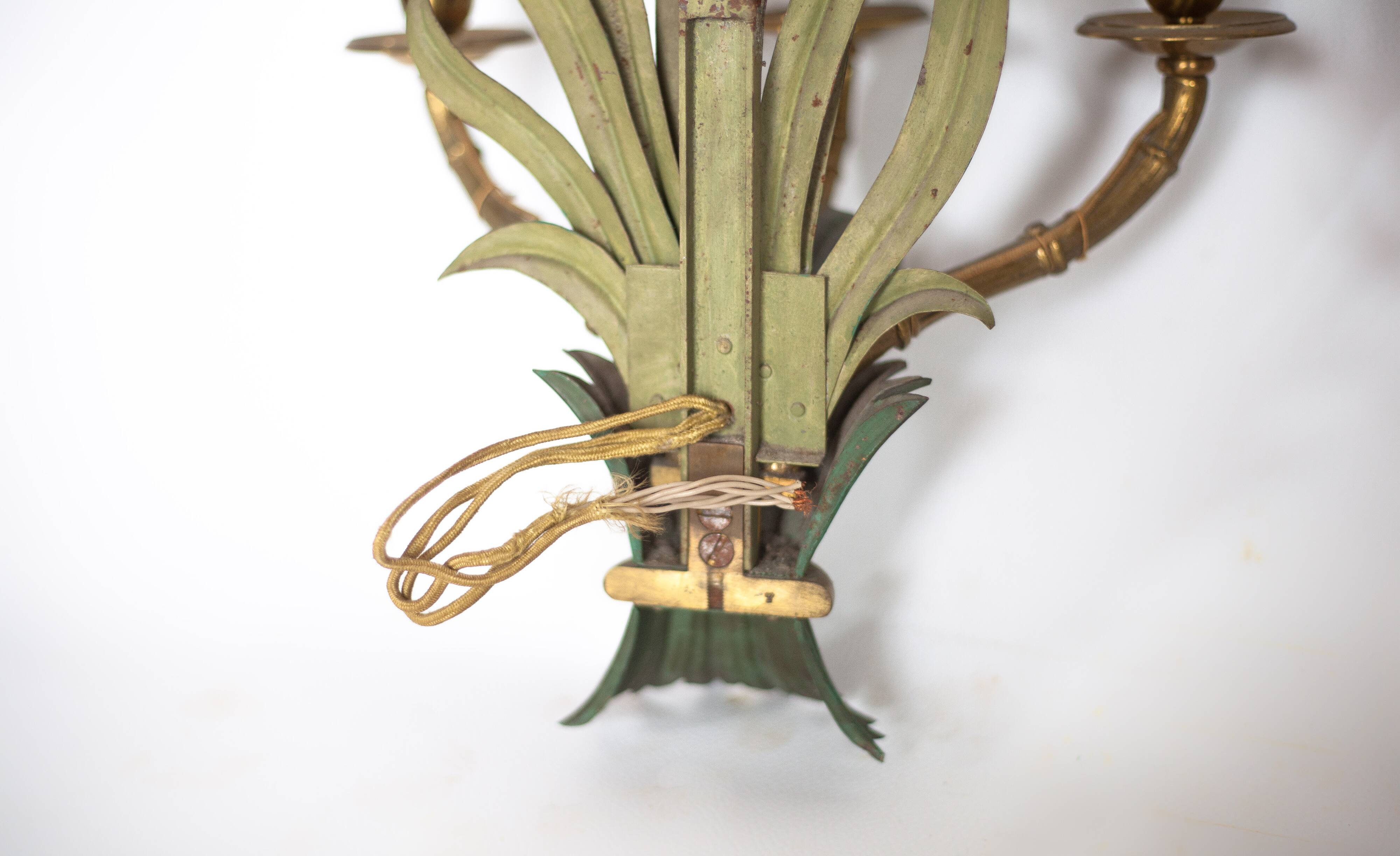 Pair of Maison Baguès wall lights with faux bamboo bronze and metal arms.