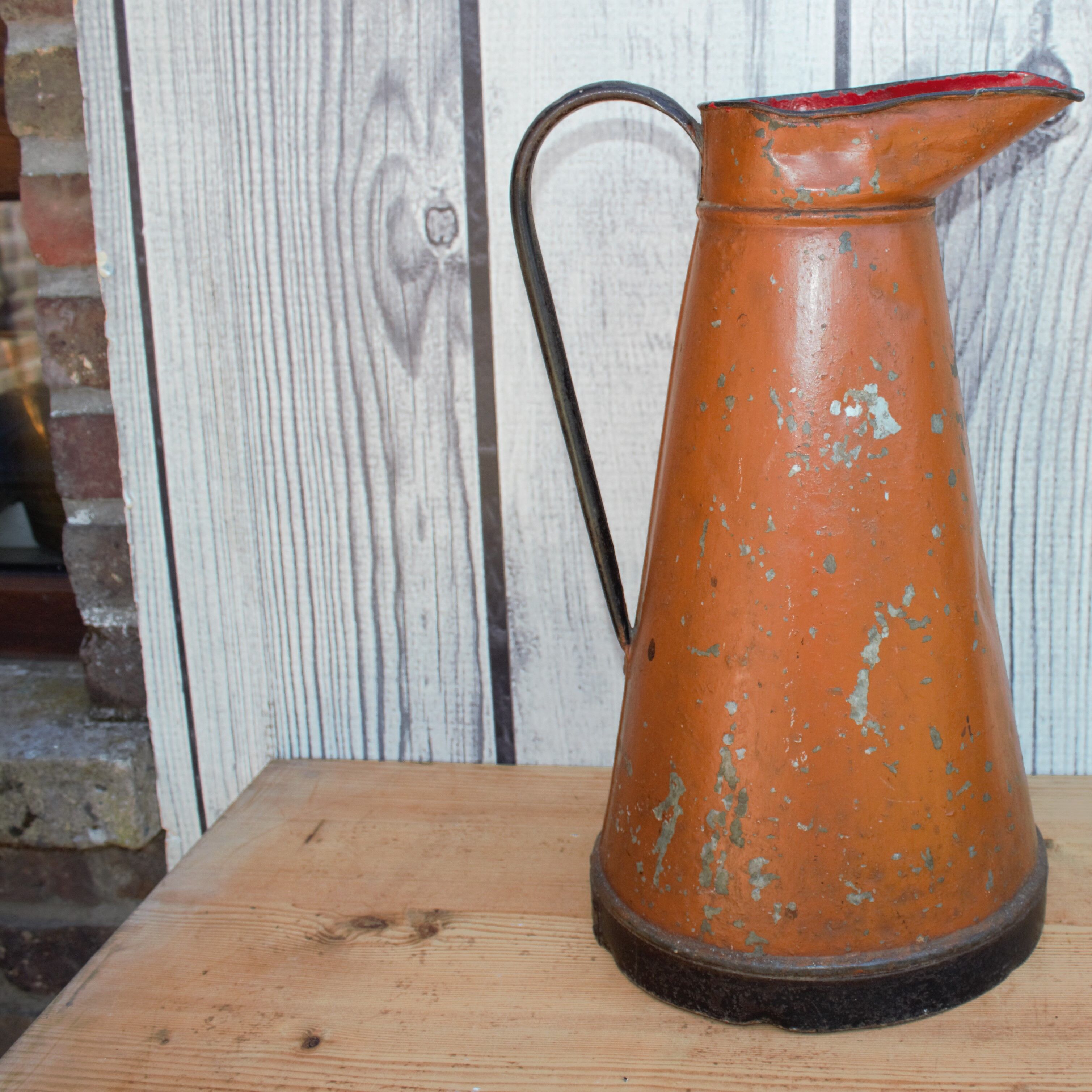 Old brown metal pitcher from France