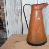 Old brown metal pitcher from France