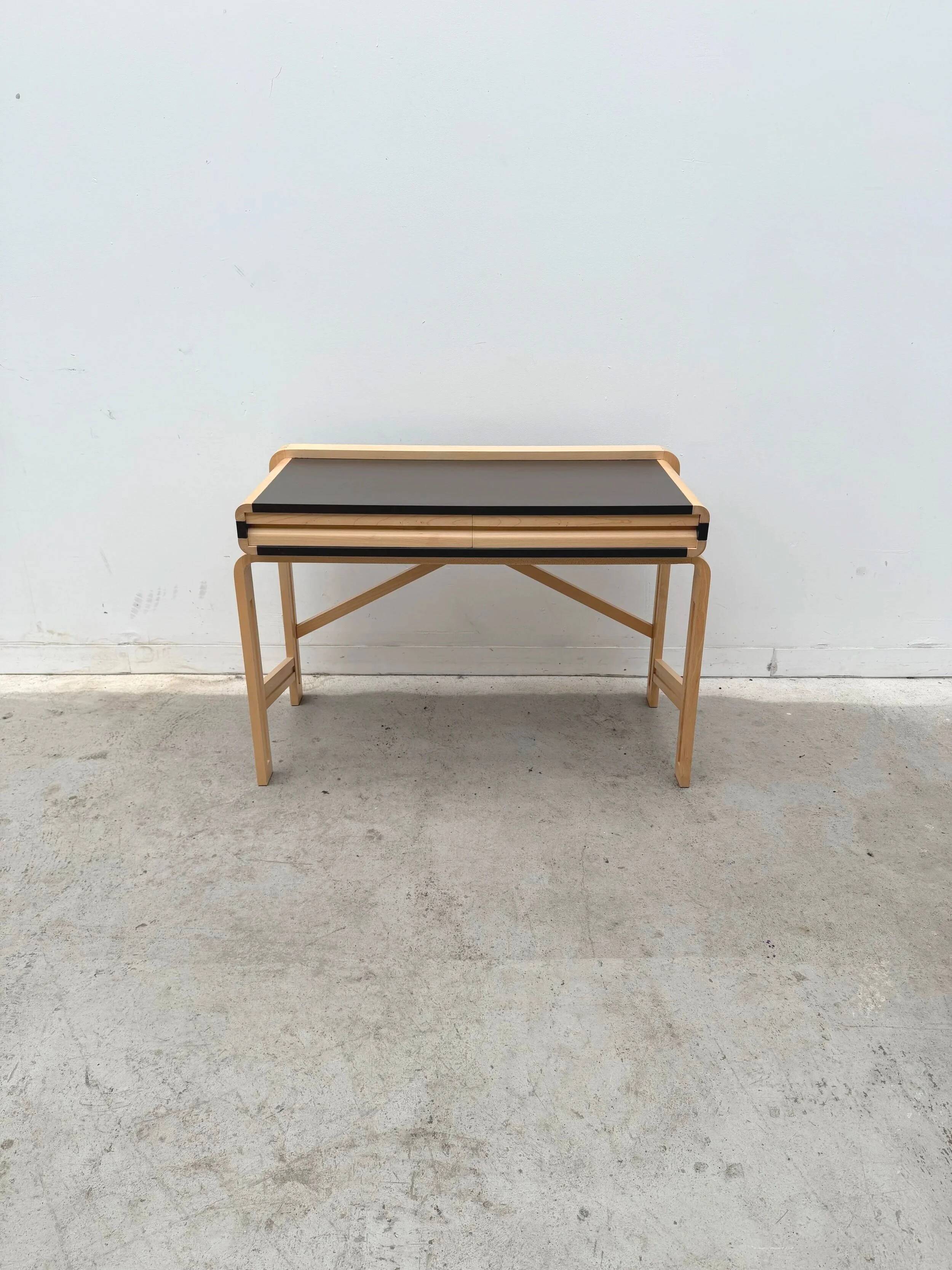 Solid wood and formica desk made by a cabinetmaker.