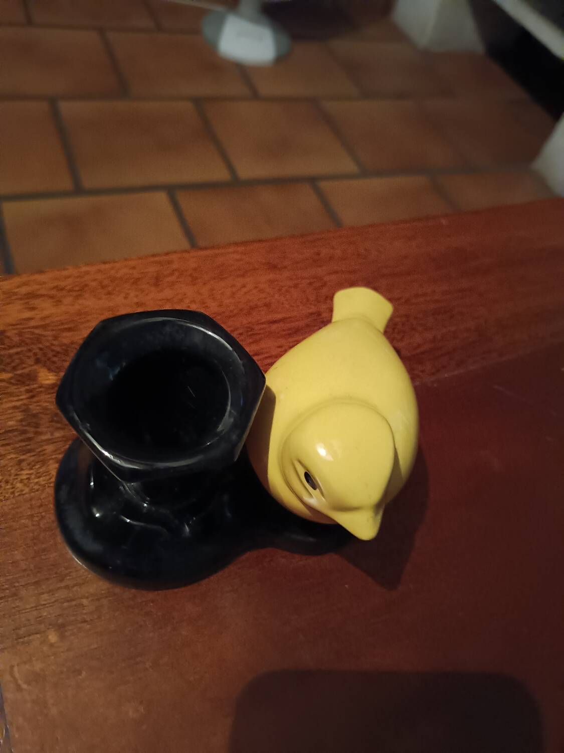 Yellow canary figurine and its candle holder