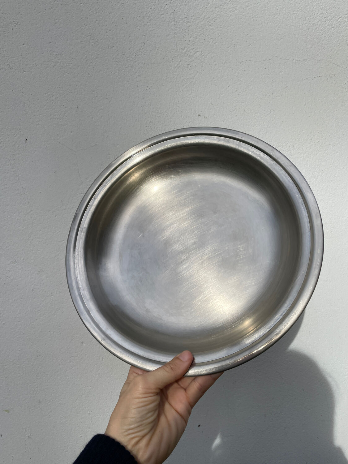 Round silver-plated metal serving dish with hallmark