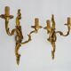 Antique pair of double-light bronze wall sconces with acanthus leaves. 1950s