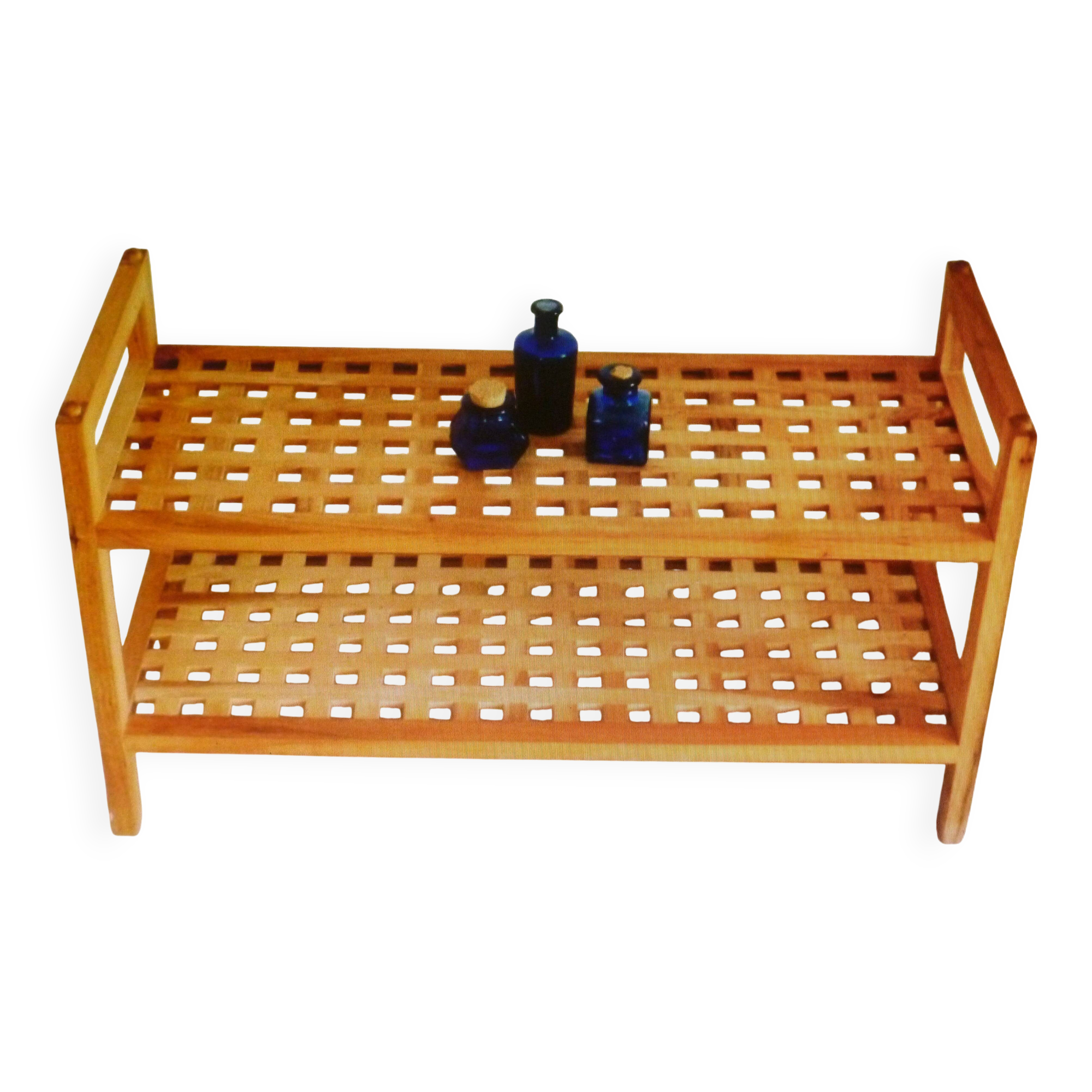 Wooden coffee table with openwork shelves and garden plant holder.