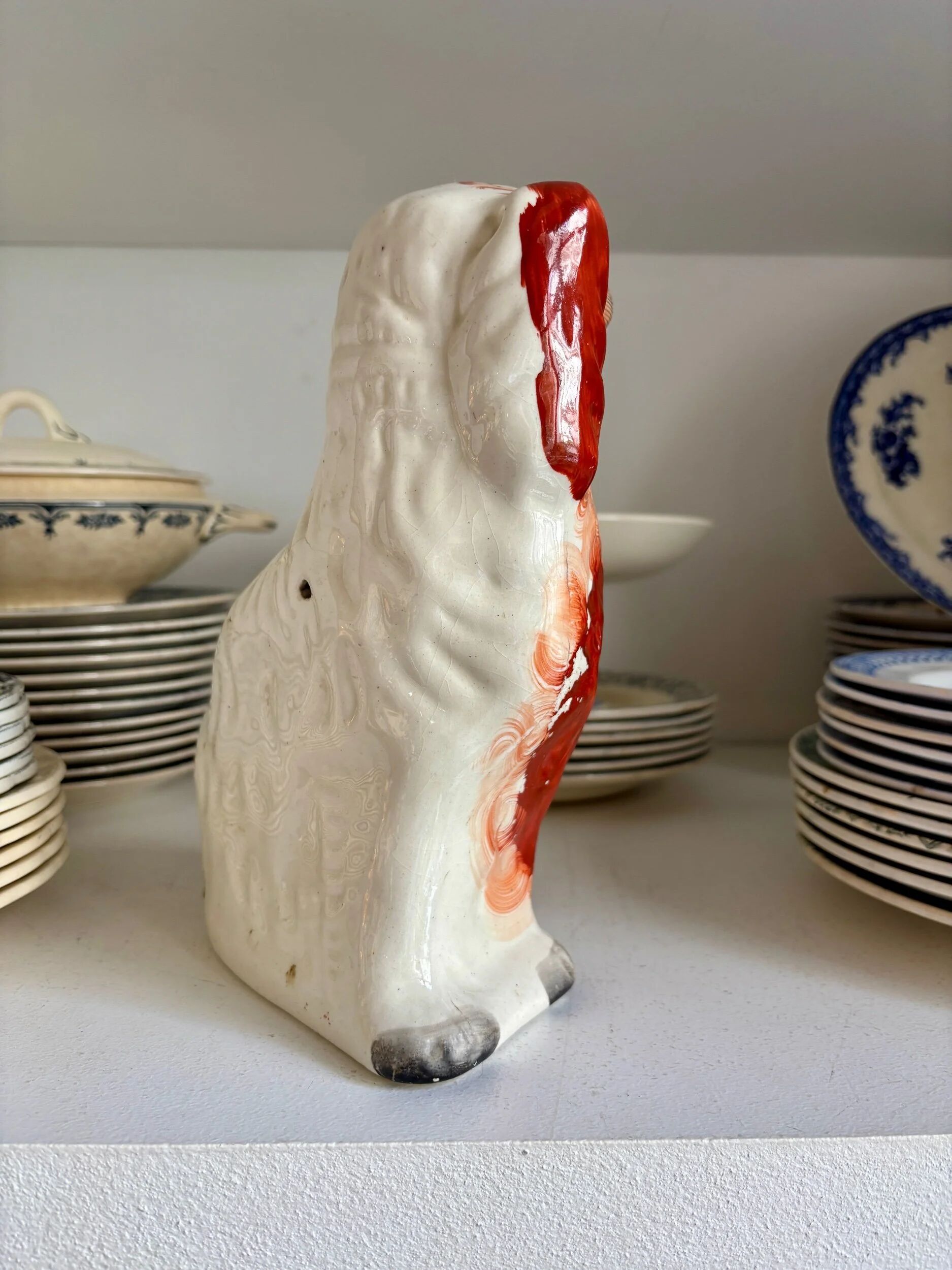 Staffordshire porcelain King Charles Cavalier dog in red, number 1, 19th century.