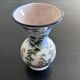 White vase with plant decoration