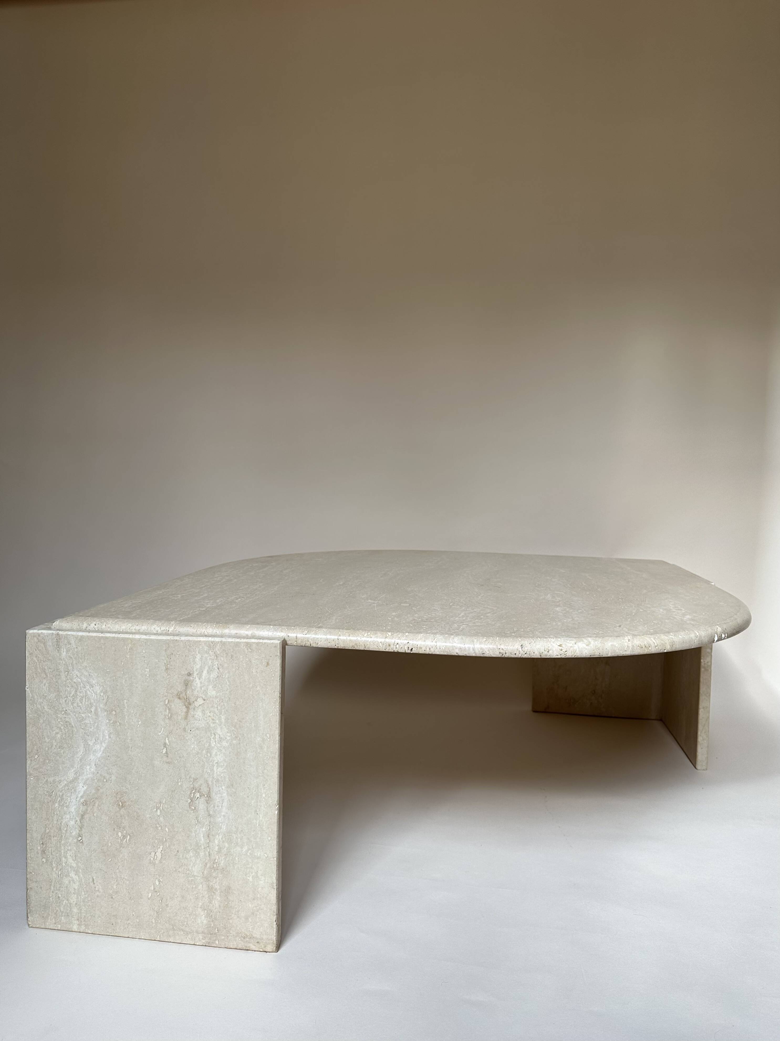 Travertine eye-shaped coffee table