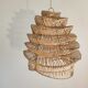 Braided rattan suspension in the shape of a natural accordion