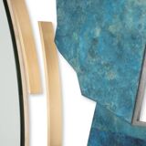 Contemporary mirror in oxidized bronze and brass with a deconstructed shape.