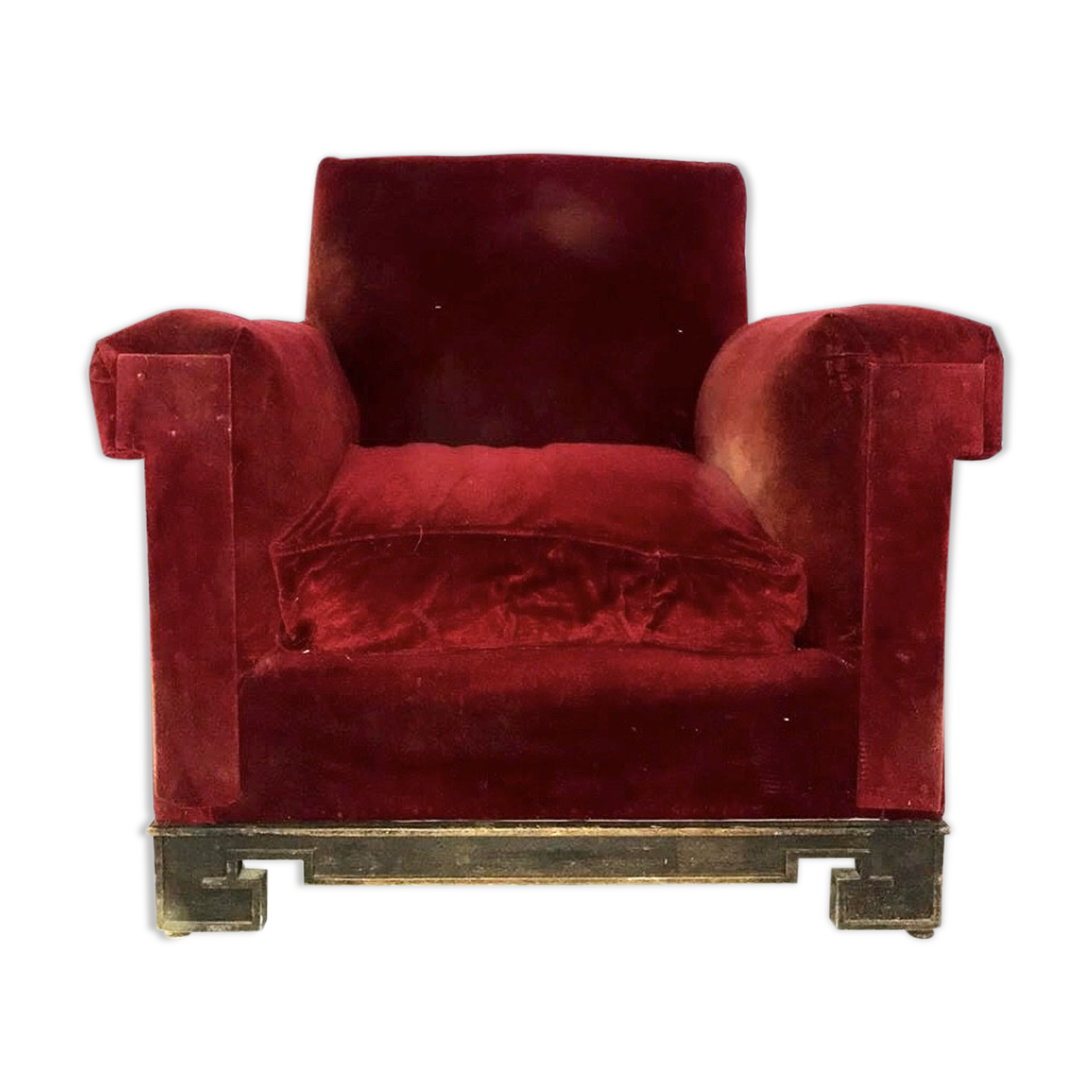 Red armchair with decorated base