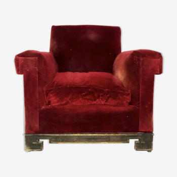 Red armchair with decorated base