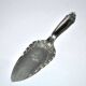 Vintage silver-plated pie server with rose decoration.