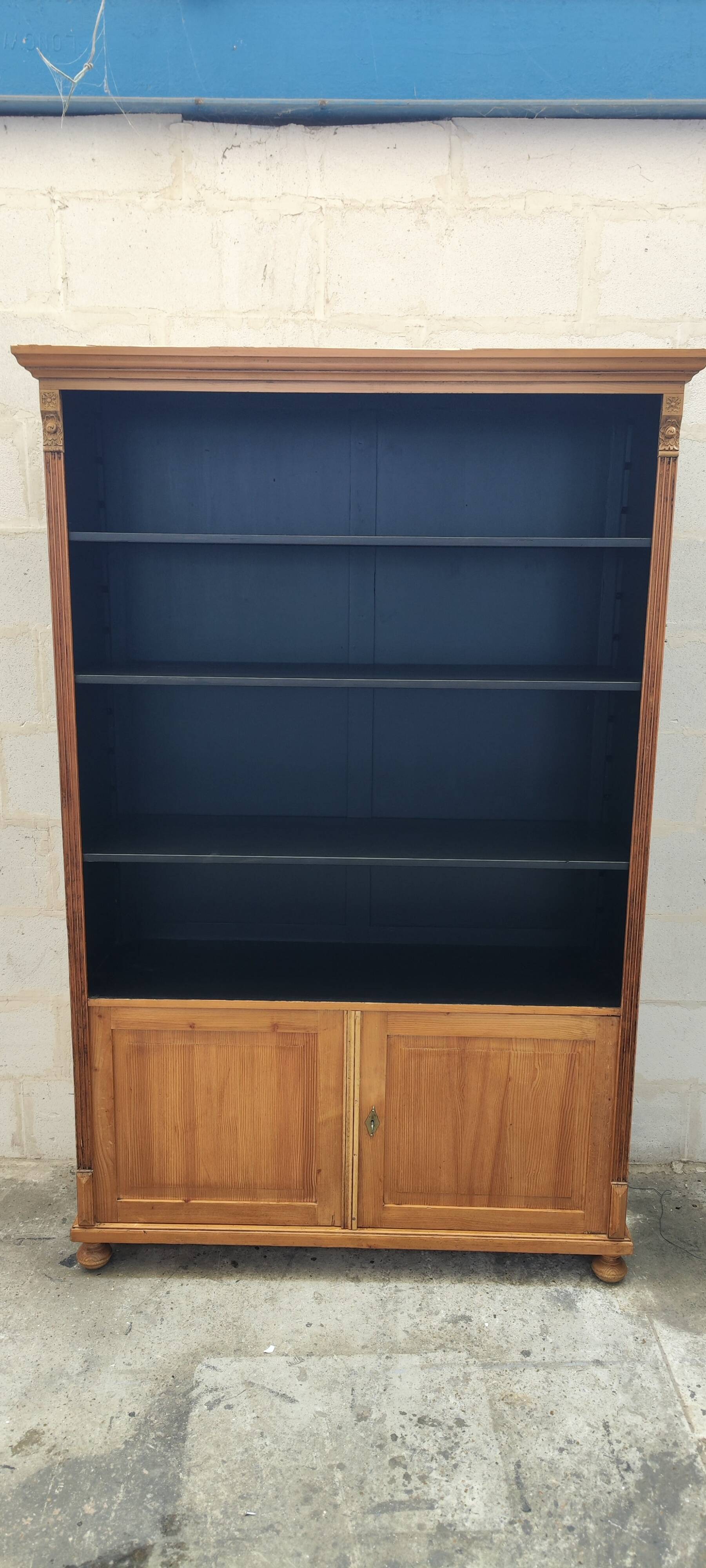 Large waxed pine bookcase with two doors