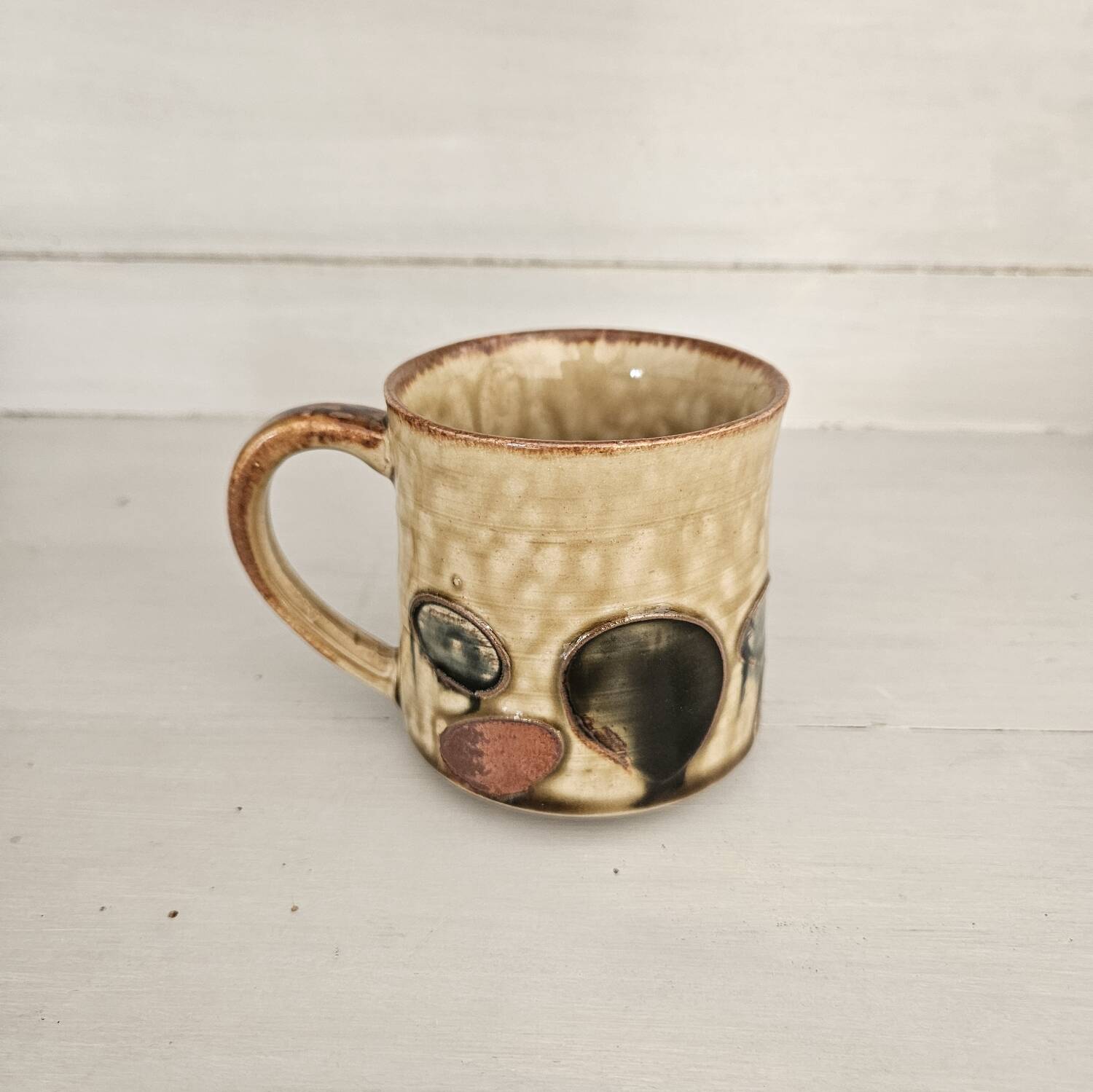 Set of 4 ceramic mugs, glazed stoneware, assorted vintage designs.