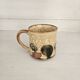 Set of 4 ceramic mugs, glazed stoneware, assorted vintage designs.