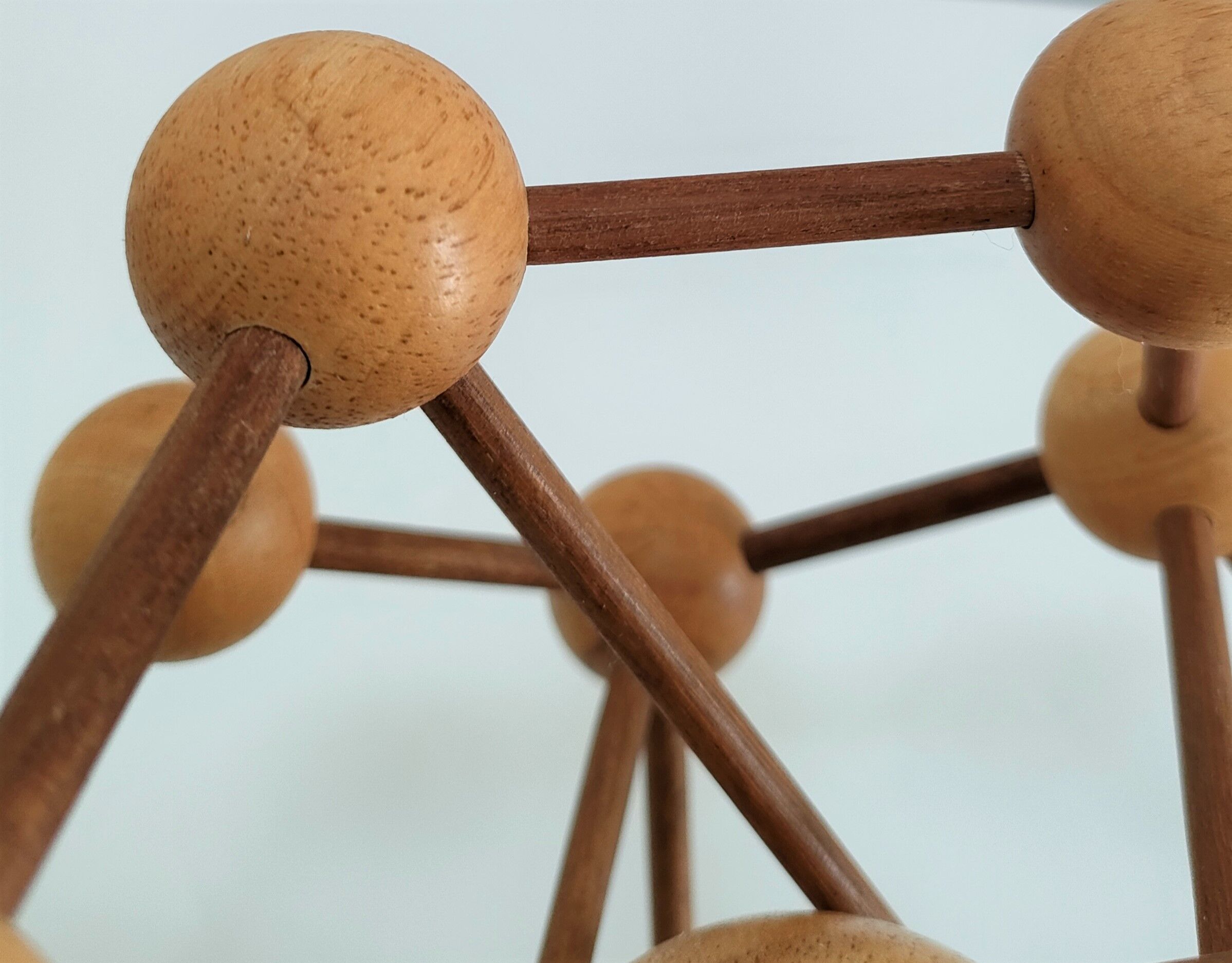 Sculptural modeling of a solid wood atom contemporary design